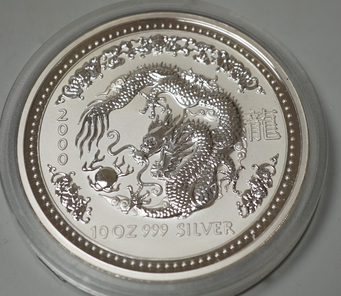 A group of boxed collector's coins